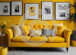 Interior design with photoframes and yellow couch photo