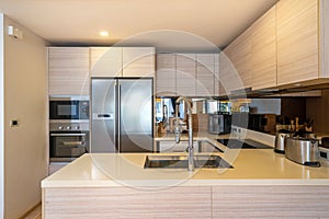 Interior design in villa, house, home, condo and apartment feature island counter, refrigerator and kitchen appliance