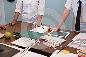 interior designer working with graphic tablet at workplace. artist discussing design and idea at office. business people