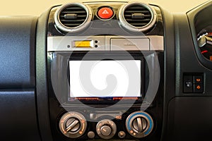 Interior detail of modern luxury car dashboard with big display and alarm button and air conditioner switch button