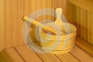 Interior details Finnish sauna steam room with traditional sauna accessories basin scoop