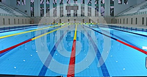 Interior details of lanes and seating in Olympic sized swimming pool