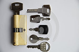 interior door lock assembly and key on a white background