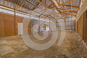 Interior of empty barn with wooden beams