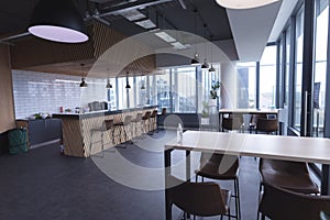 Interior of empty cafeteria with tables in modern office