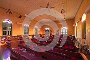 Interior of empty christian church with cross, architecture design. Religious beliefs. Catholic religion. Jesus worship