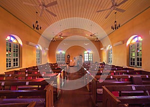 Interior of empty christian church with cross, architecture design. Religious beliefs. Catholic religion. Jesus worship