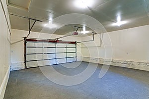 Interior of an empty clean garage with closed door