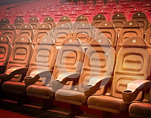 Interior of empty hall with brown arm chairs