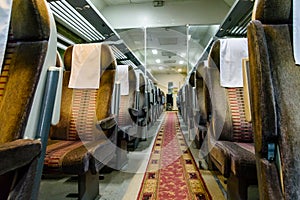 Interior of the empty railroad car with comfortable seats