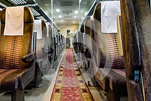 Interior of the empty railroad car with comfortable seats