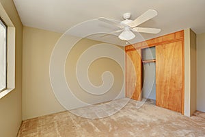 Interior of empty room with closet and carpet floor
