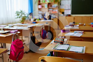 Interior of an empty school classroom. Concept of coronavirus COVID-19 quarantine in schools and educational institutions photo