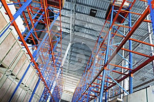 Interior of Empty Storage Warehouse. Racks Pallets Shelves. Metal Construction. Row of Tall Shelf in Distribution Storehouse