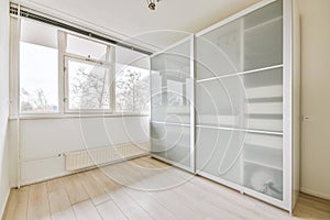 Interior of an emptyroom with large