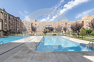 Interior facades of a block patio of residential buildings with gardens and summer swimming pools with gardens and decorative photo