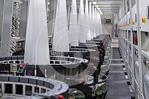 Interior of a factory shop. Equipment for weaving polypropylene fabric.