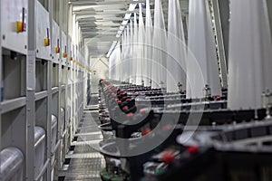 Interior of a factory shop. Equipment for weaving polypropylene fabric.