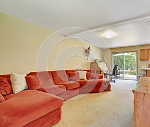 Interior of family room with extra Large red sofa