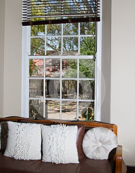 Interior of farmhouse showing huge sash windows.