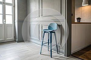 Interior with blue counter stool and grey wall