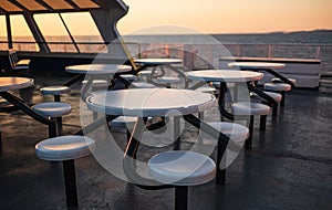 Interior of the ferry. Ferry furniture. Empty seats without passengers. Sea transport, deck chairs and tables on a ship