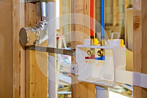 Interior framing of a plumbing outlet box for the laundry room in new home under construction