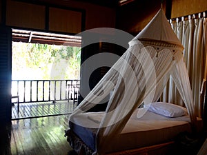 Interior furnishings bedroom bed private balcony beachfront chalet photo