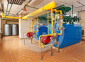 Interior gas boiler house with a lot of industrial boilers, pipe