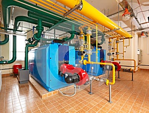 Interior gas boiler house with a lot of industrial boilers, pipe