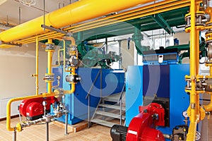 Interior gas boiler house with a lot of industrial boilers, pipe