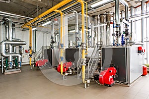 The interior of gas boiler, with three boilers.