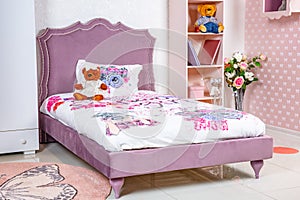 Interior of a girl`s bedroom. teenager`s room pink colour