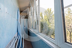 The interior of the glazed balcony of the apartment