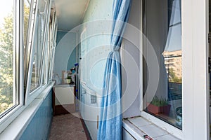 The interior of the glazed spacious balcony of the apartment