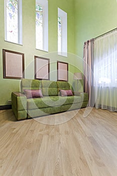 Interior in green colors and a glass chandelier