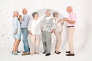 Interior with group of senior happy people in casual cloths