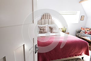 Interior Of Guest Room In Bed And Breakfast Hotel Viewed Through Door