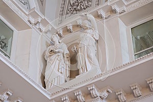 Interior of the Hermitage Museum with marble sculpture and beautiful fresco ceiling