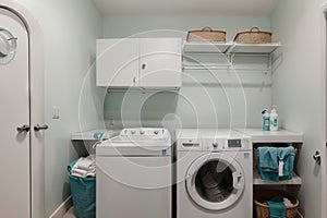 Interior of home laundry room with modern washing machine