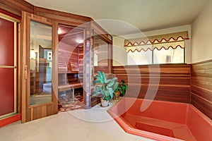 Interior of home wooden sauna cabin with jacuzzi bath