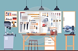 Interior of home workshop with tools, work table and special machines. Different construction equipment and supplies for