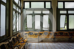 Interior of a hospitall waiting room with view on windows. Day