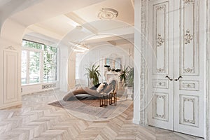 Interior in hotel. daylight in the interior and light of electric lamps. luxury living room with parquet wood floors