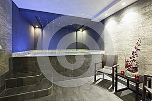 Interior of a hotel spa with jacuzzi bath with ambient lights