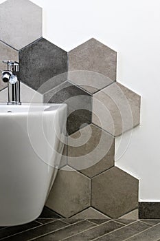 Interior of a house, private bathroom. hexagonal tiles with natural colors on gray brown in a bathroom. interior furnishings and