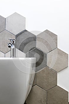 Interior of a house, private bathroom. hexagonal tiles with natural colors on gray brown in a bathroom. interior furnishings and