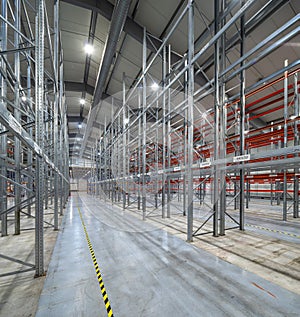 Interior of huge empty storehouse. Industrial warehouse racking.