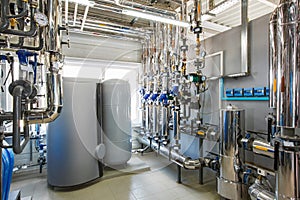 The interior of an industrial boiler house with a multitude of p