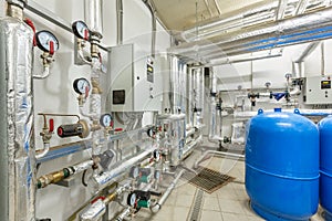 Interior of an industrial boiler house, technological unit with many sensors, indicators and valves